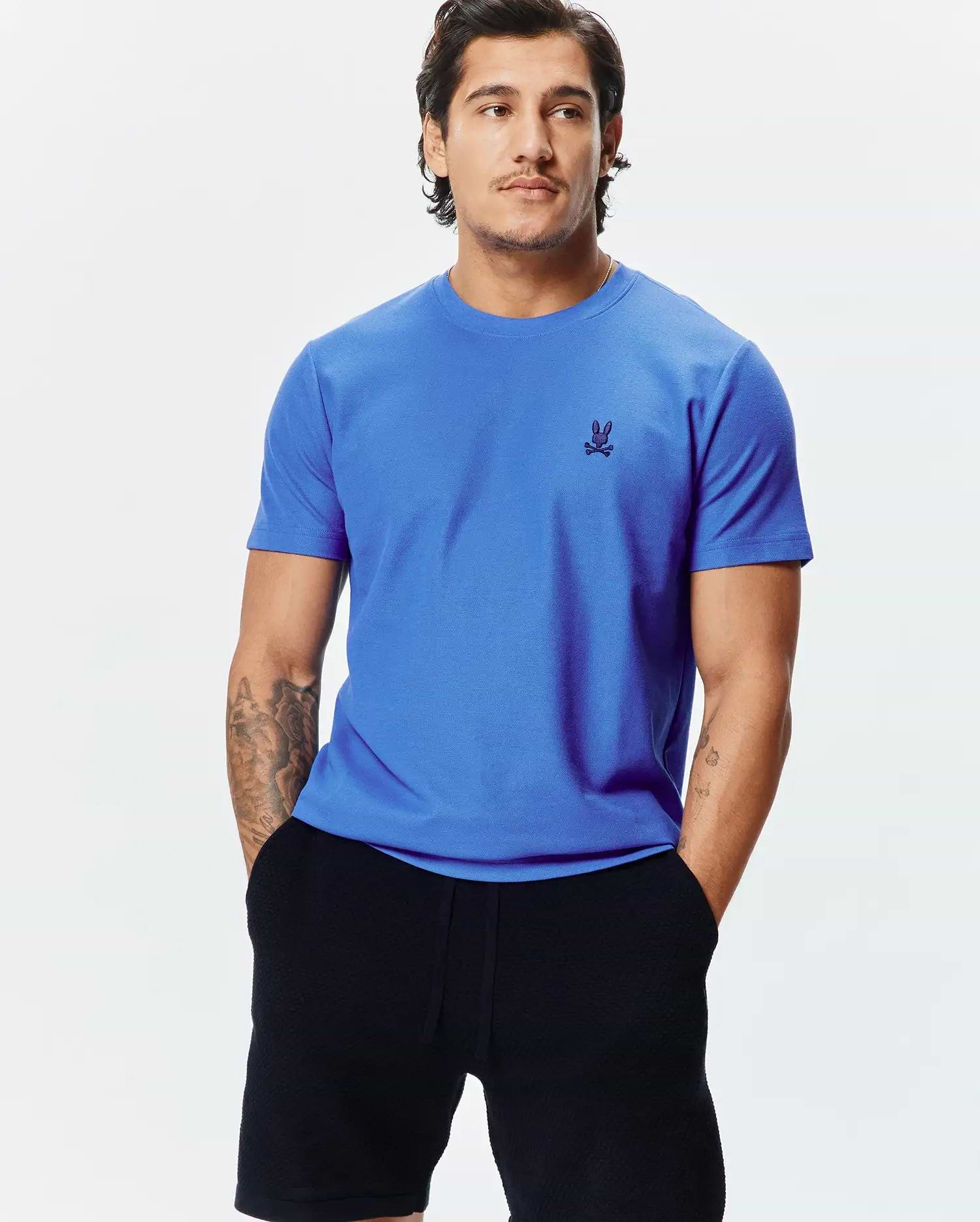 Mens Taylor Pique Tee, a vibrant royal blue classic fit t-shirt with a visible pique knit texture, featuring a small, embroidered dark blue Psycho Bunny skull logo on the left chest.