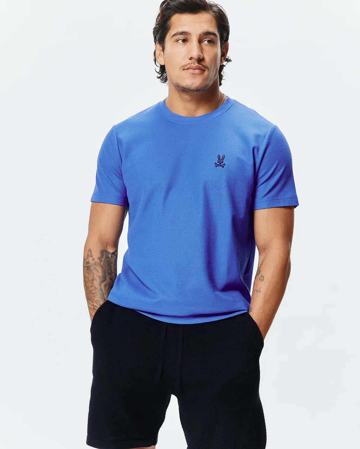 Mens Taylor Pique Tee, a vibrant royal blue classic fit t-shirt with a visible pique knit texture, featuring a small, embroidered dark blue Psycho Bunny skull logo on the left chest.