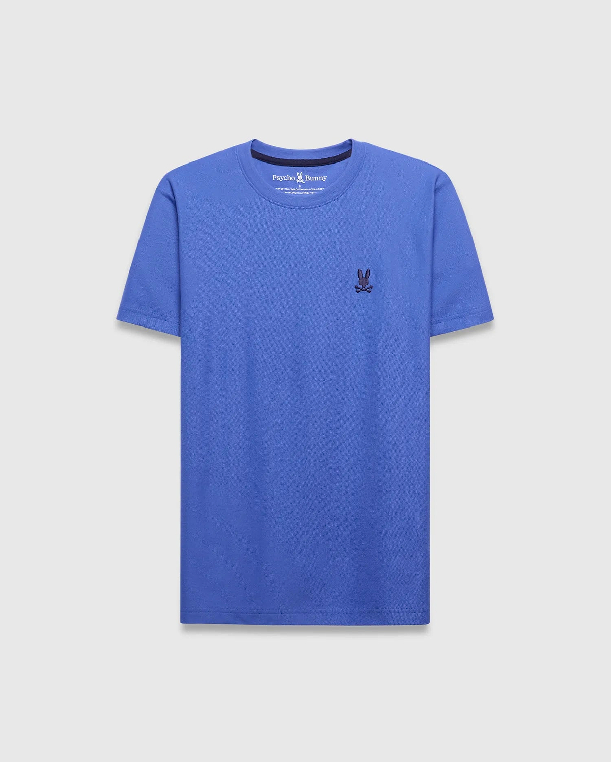 Mens Taylor Pique Tee in vibrant cobalt blue, classic fit, with a small, dark navy embroidered Psycho Bunny skull logo on the left chest.