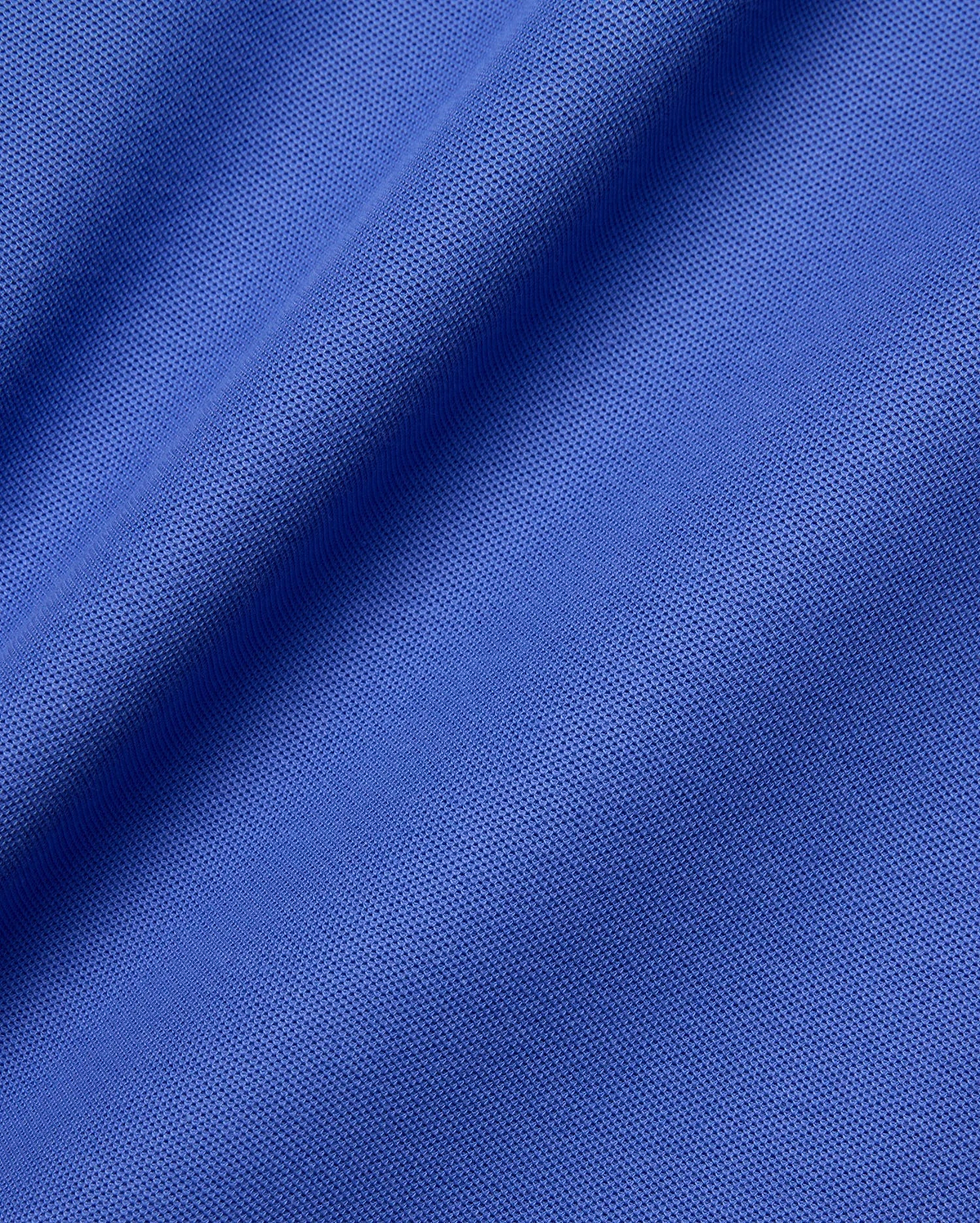 Psycho Bunny Mens Taylor Pique Tee fabric close-up, featuring a rich royal blue hue and the signature textured pique knit, ideal for refined streetwear.