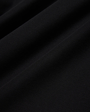 Psycho Bunny Mens Taylor Pique Tee in rich black, highlighting the premium, breathable pique knit fabric texture with subtle, elegant folds and shadows, perfect for refined streetwear.