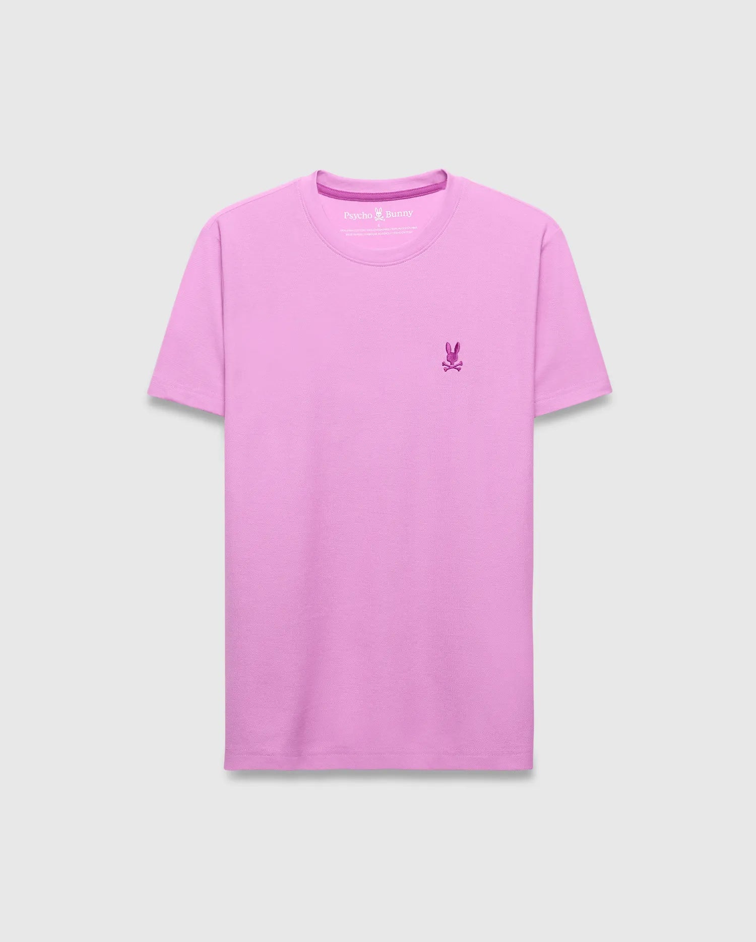 Mens Taylor Pique Tee in lavender pink, featuring a classic fit and pique texture. A small, embroidered dark pink Psycho Bunny skull logo adorns the left chest, complemented by a matching inner neck trim.