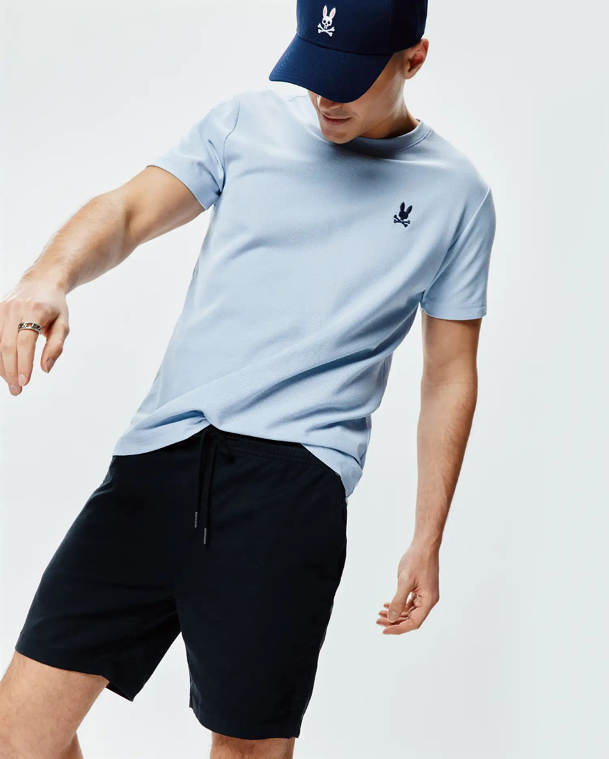 Light blue Mens Taylor Pique Tee with a classic fit, featuring a small, dark blue embroidered Psycho Bunny skull logo on the left chest.