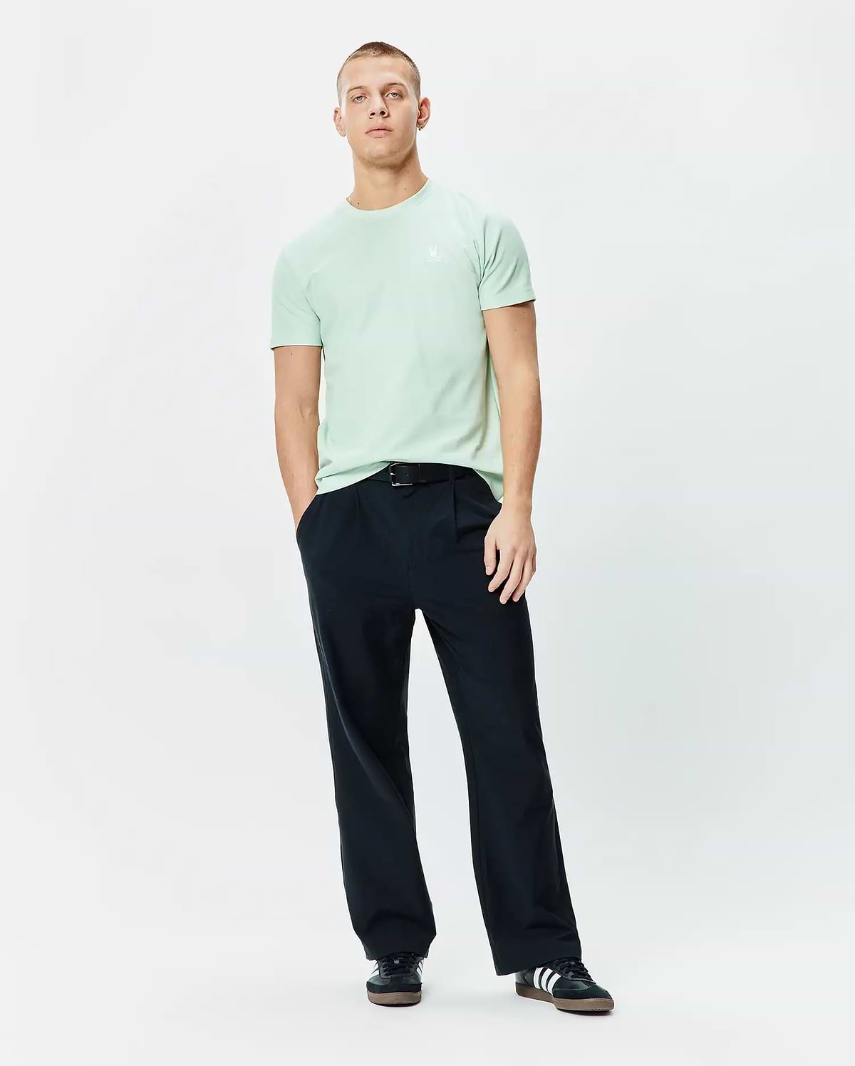 Vibrant mint green Mens Taylor Pique Tee, featuring a classic fit and the iconic small, embroidered white Psycho Bunny skull logo on the left chest.