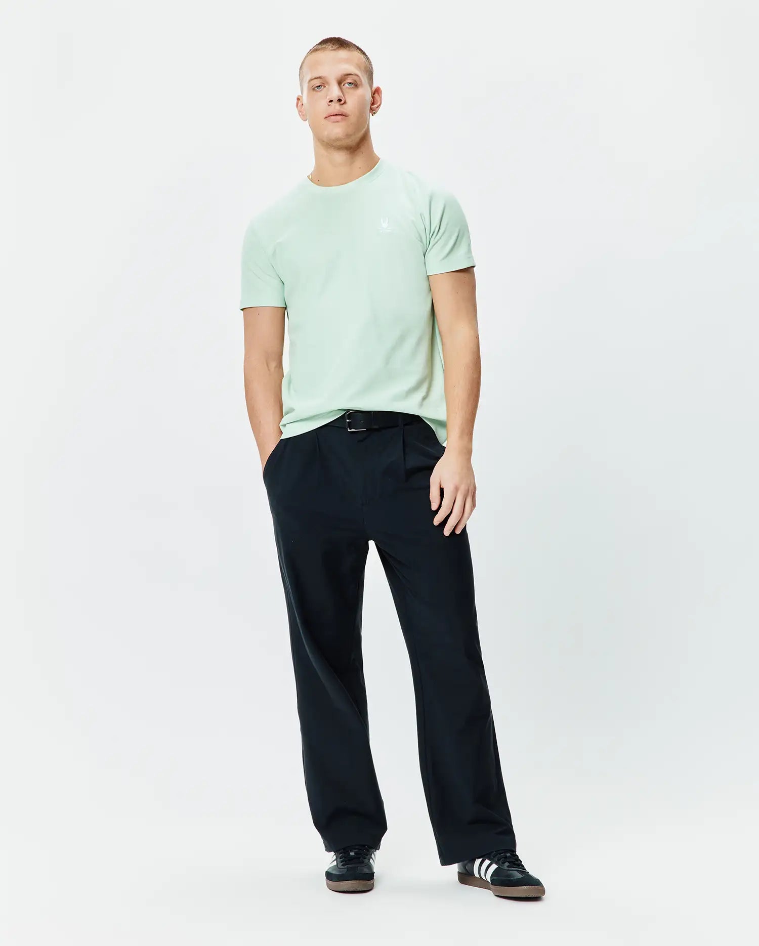 Vibrant mint green Mens Taylor Pique Tee, featuring a classic fit and the iconic small, embroidered white Psycho Bunny skull logo on the left chest.