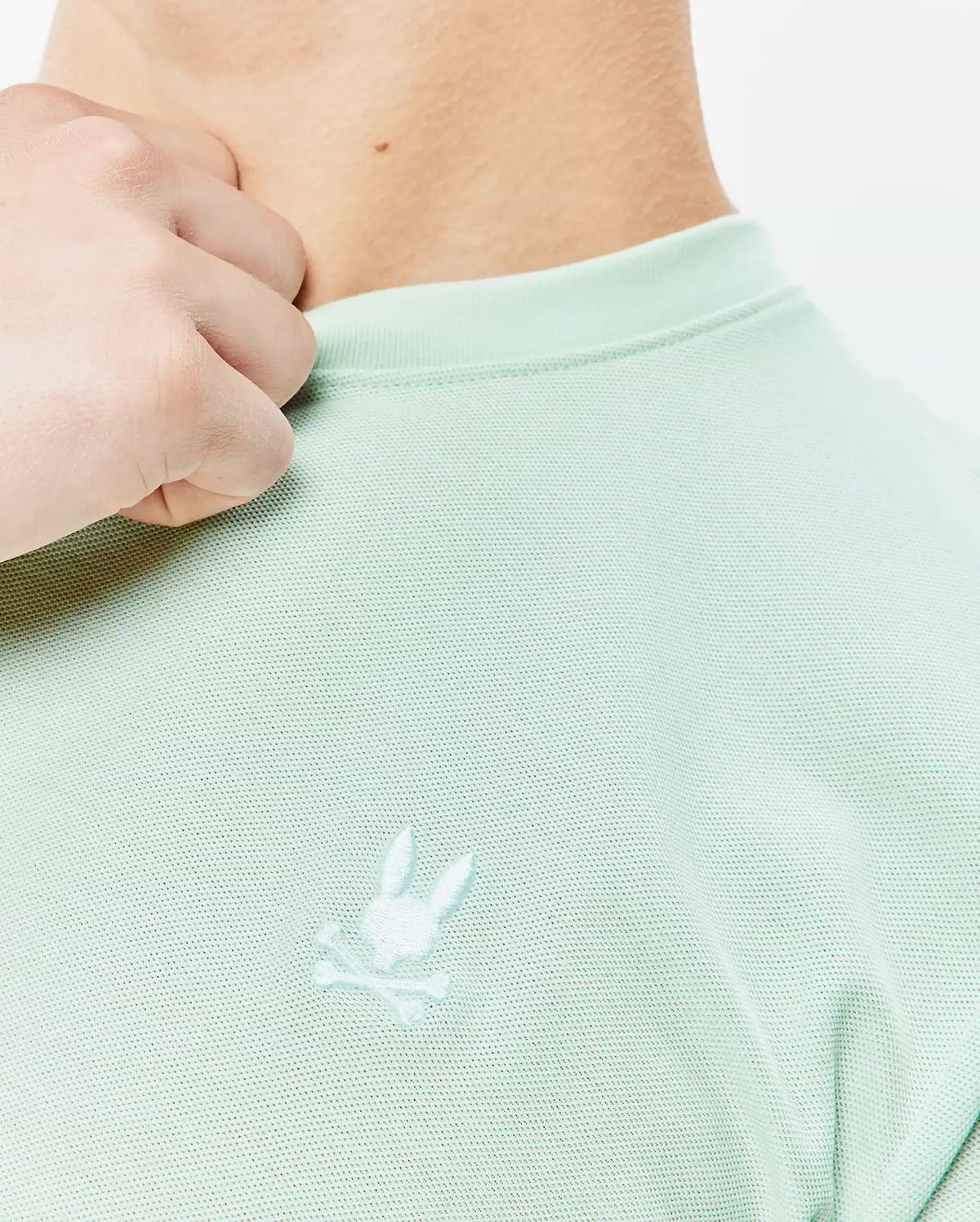 Mint green Mens Taylor Pique Tee with a classic fit, featuring a subtle pique texture and a small, tonal embroidered Psycho Bunny skull logo on the left chest.