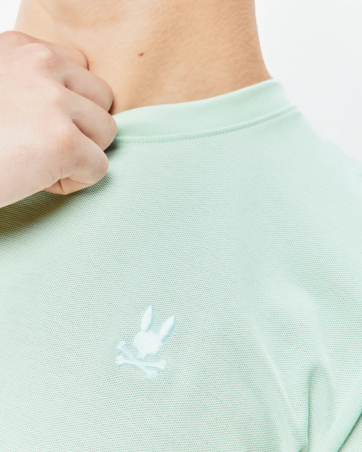 Mint green Mens Taylor Pique Tee with a classic fit, featuring a subtle pique texture and a small, tonal embroidered Psycho Bunny skull logo on the left chest.