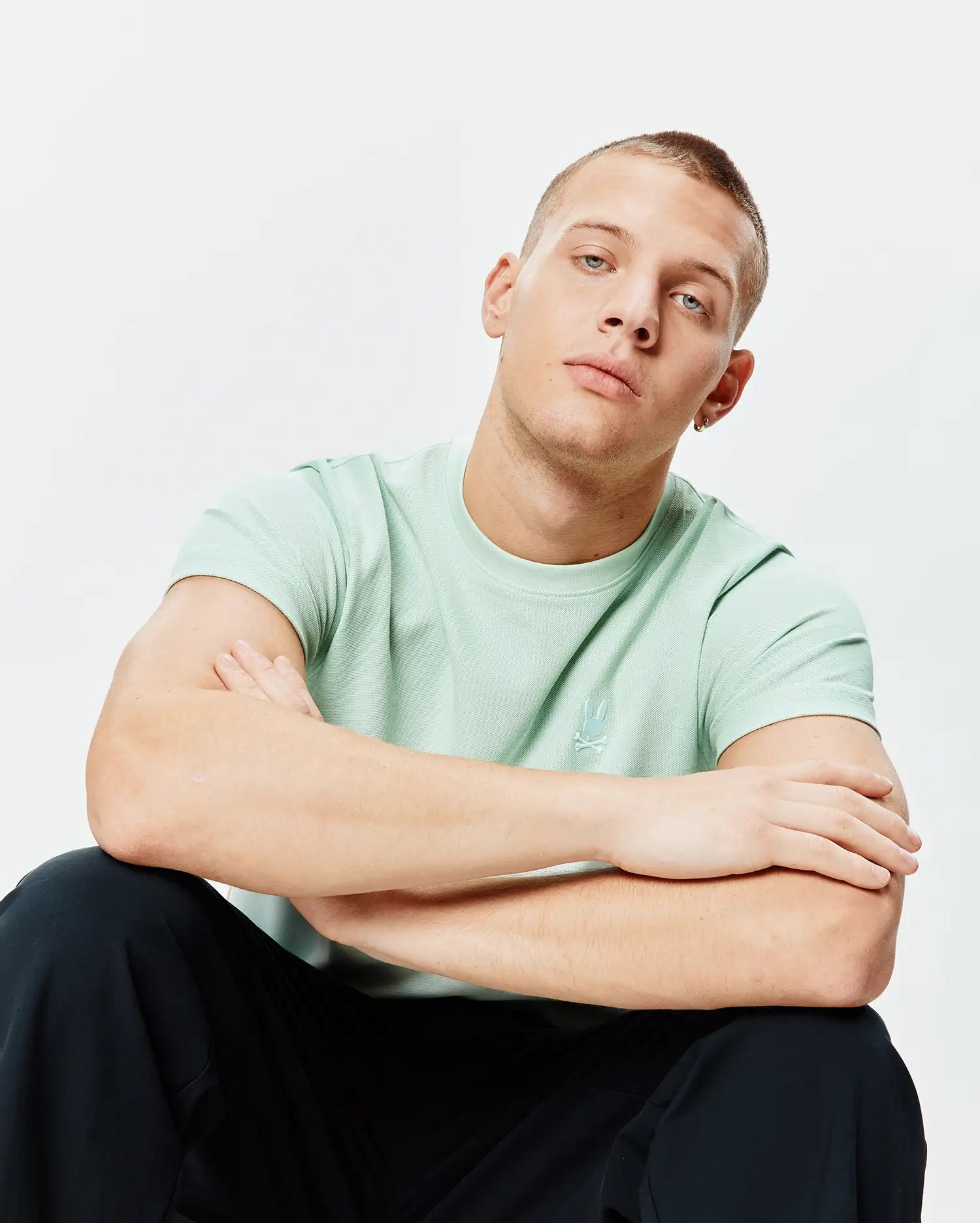 Light mint green Mens Taylor Pique Tee, a classic fit t-shirt with a subtle, tonal embroidered Psycho Bunny skull logo on the left chest.