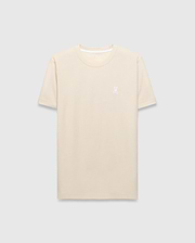 Mens Taylor Pique Tee in cream, featuring a classic fit and subtle pique texture. A small, white embroidered Psycho Bunny skull logo adorns the left chest.