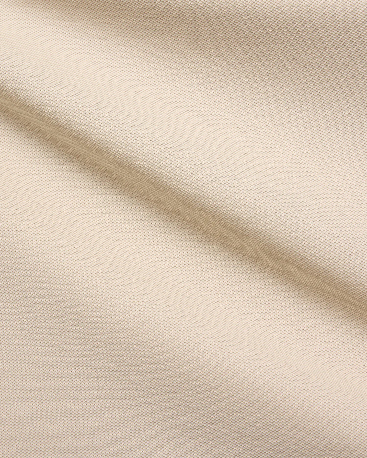 Mens Taylor Pique Tee in a premium light beige pique fabric, showcasing its refined texture and subtle weave, perfect for elevated casual wear and modern streetwear style.