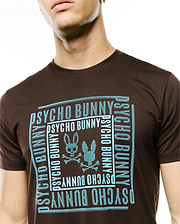 Men's Raj Wordmark Graphic Tee, a classic fit brown jersey t-shirt with a large central light blue dotted graphic featuring the Psycho Bunny wordmark and iconic bunny skull logo. (3)