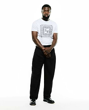 White Men's Raj Wordmark Graphic Tee, classic fit jersey, featuring a prominent central black Psycho Bunny skull and repeated wordmark grid graphic. (6)