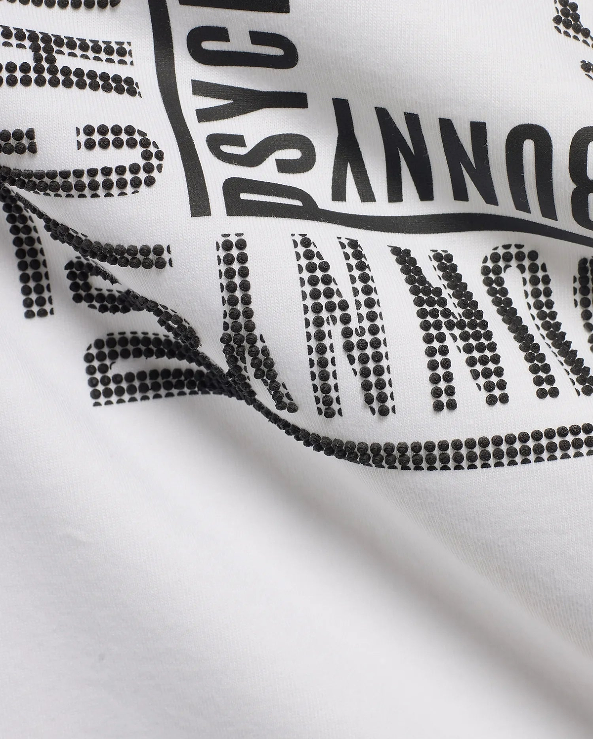 White Men's Raj Wordmark Graphic Tee in jersey knit, featuring a large black Psycho Bunny wordmark with a unique textured design where some letters are solid and others are raised black dots. (7)