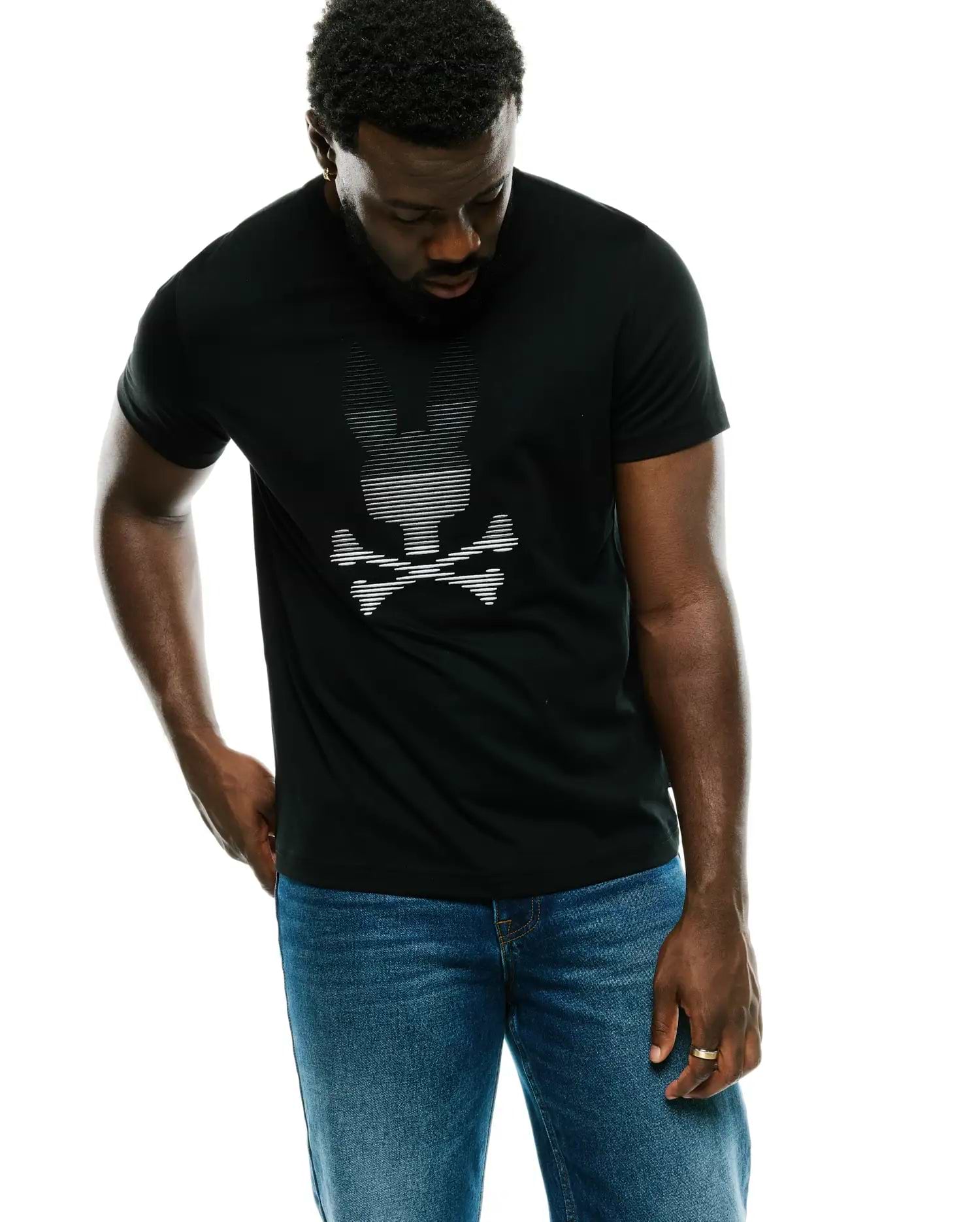 Men's Slade Bunny Graphic Tee, a classic fit black jersey t-shirt featuring a large white striped Psycho Bunny skull logo prominently on the center chest. (2)