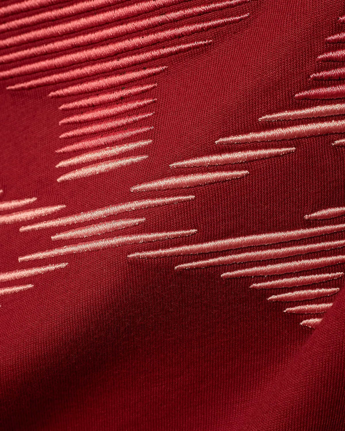 Men's Slade Bunny Graphic Tee in rich burgundy jersey knit, featuring a premium embroidered pattern of light pink horizontal dashes arranged dynamically across the fabric, reflecting refined streetwear style. (6)