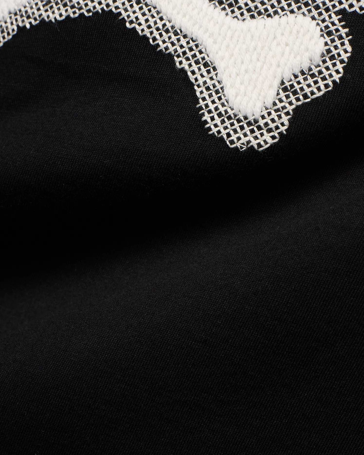 Men's Samson Graphic Tee: Black jersey knit with a large white textured graphic featuring a distinctive white cross-stitch outline, showcasing the iconic Psycho Bunny design. (6)