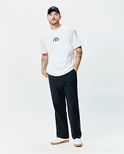 White Mens Stevie Relaxed Fit Tee in smooth jersey, featuring a small embroidered black Psycho Bunny arched text and iconic bunny skull logo on the center chest, offering a relaxed fit.