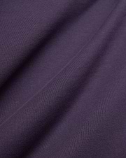 Dark Purple Mens Windcrest Relaxed Fit Tee fabric, featuring a soft, finely ribbed jersey knit texture with subtle vertical lines and gentle folds.