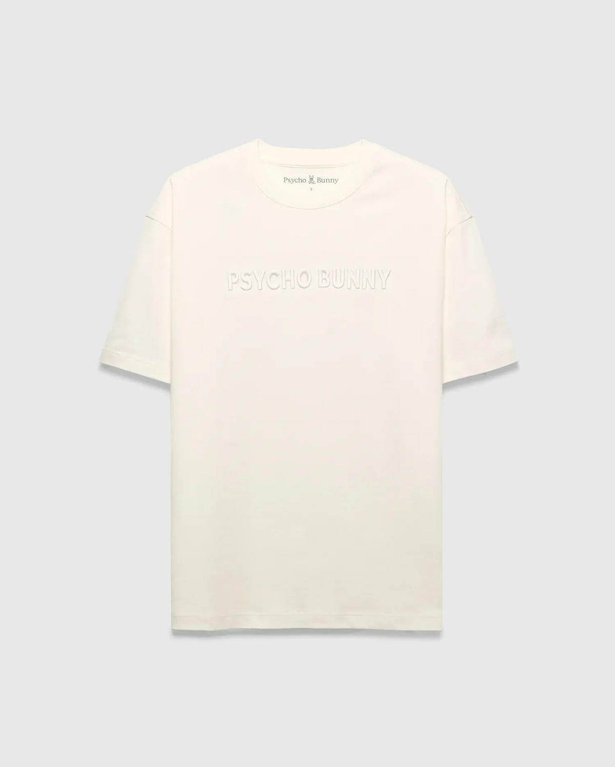 Mens Windcrest Relaxed Fit Tee in cream jersey, featuring a large tonal embossed PSYCHO BUNNY chest logo and a small embroidered bunny skull on the back neck. (5)