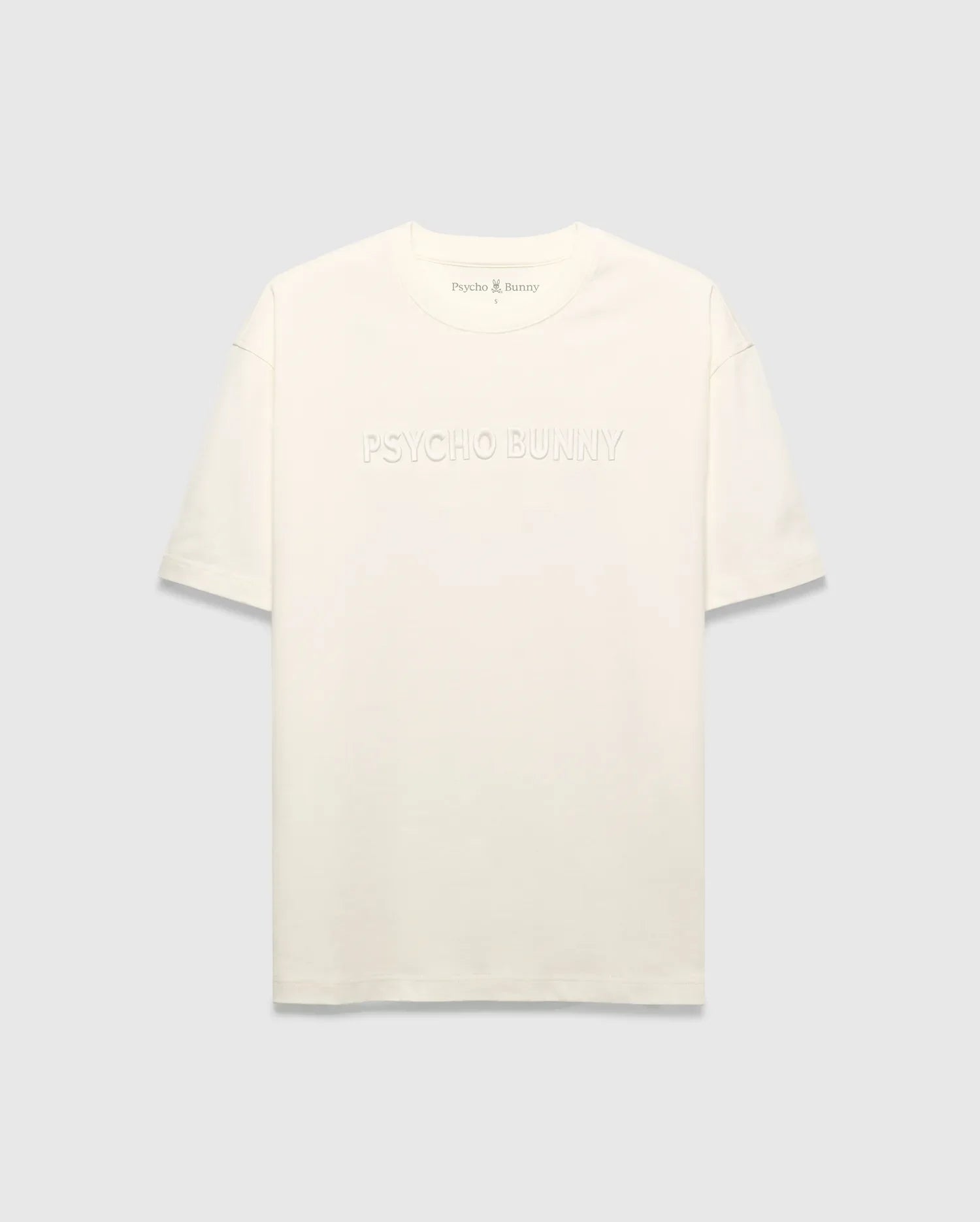Mens Windcrest Relaxed Fit Tee in cream jersey, featuring a large tonal embossed PSYCHO BUNNY chest logo and a small embroidered bunny skull on the back neck. (5)