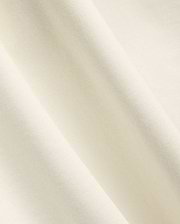 Mens Windcrest Relaxed Fit Tee in a soft, creamy off-white hue, showcasing its premium, smooth fine jersey knit fabric texture with elegant, flowing diagonal folds. (6)