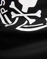 Mens Santa Fe Bunny Graphic Tee, a black jersey knit t-shirt featuring a bold white graphic print of crossbones and partial Psycho Bunny logo text.