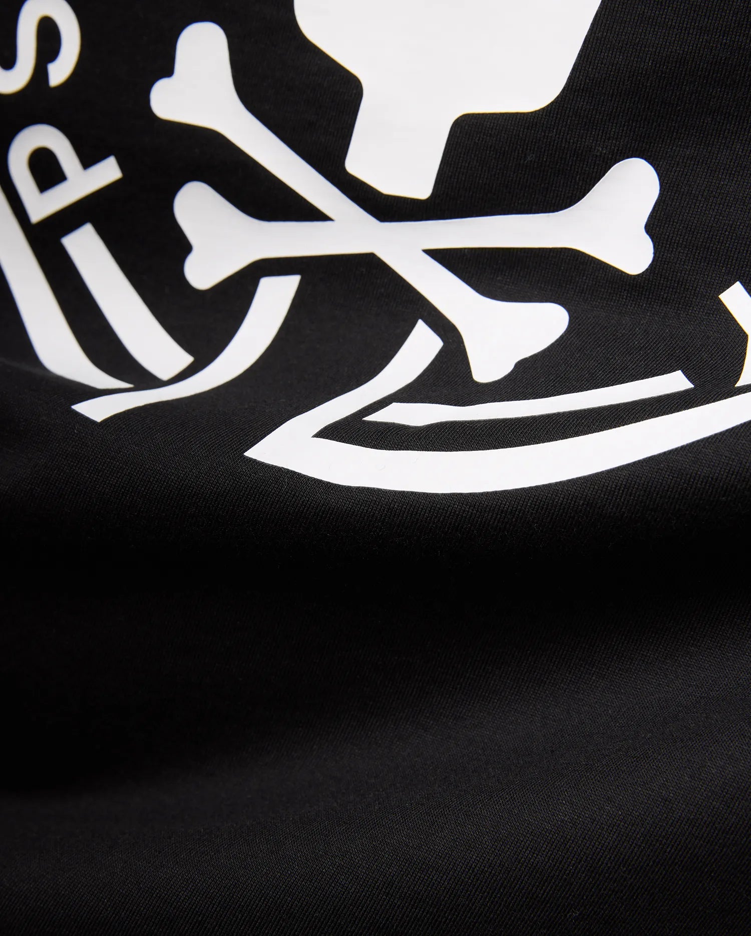 Mens Santa Fe Bunny Graphic Tee, a black jersey knit t-shirt featuring a bold white graphic print of crossbones and partial Psycho Bunny logo text.