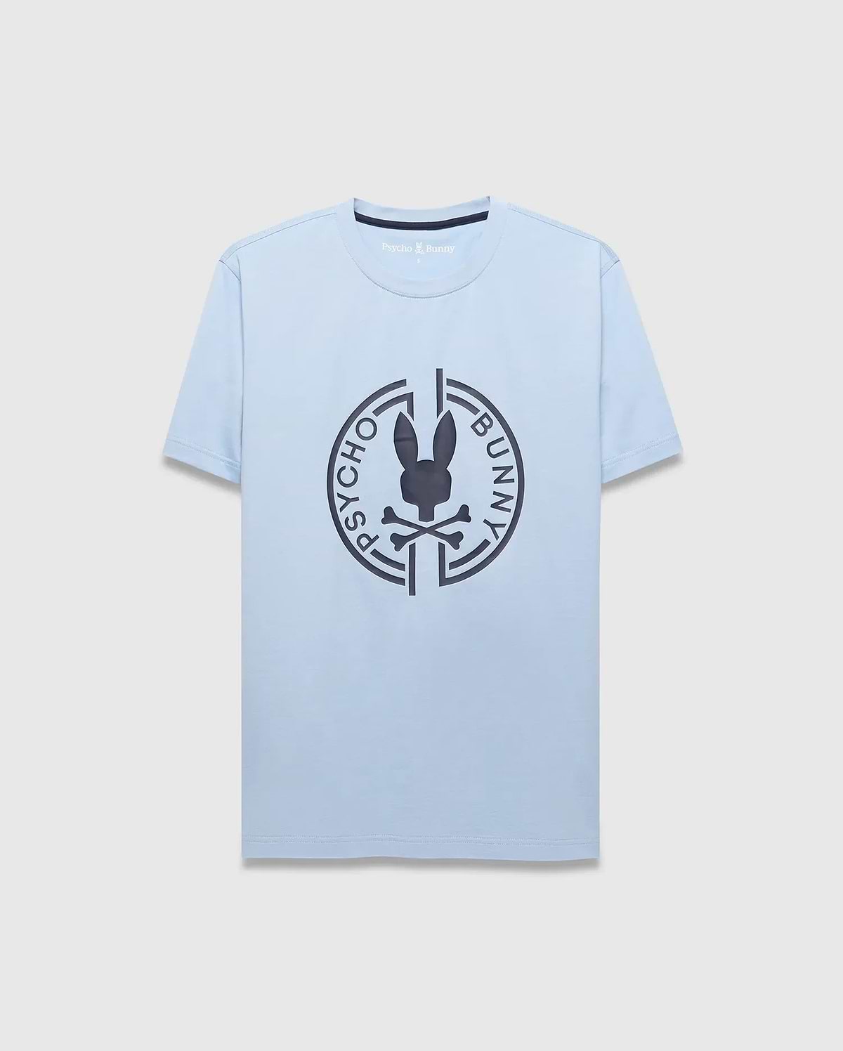 Mens Santa Fe Bunny Graphic Tee. Light blue jersey t-shirt with a classic fit, featuring a large dark grey circular chest graphic of the iconic Psycho Bunny skull logo and brand name. (1)