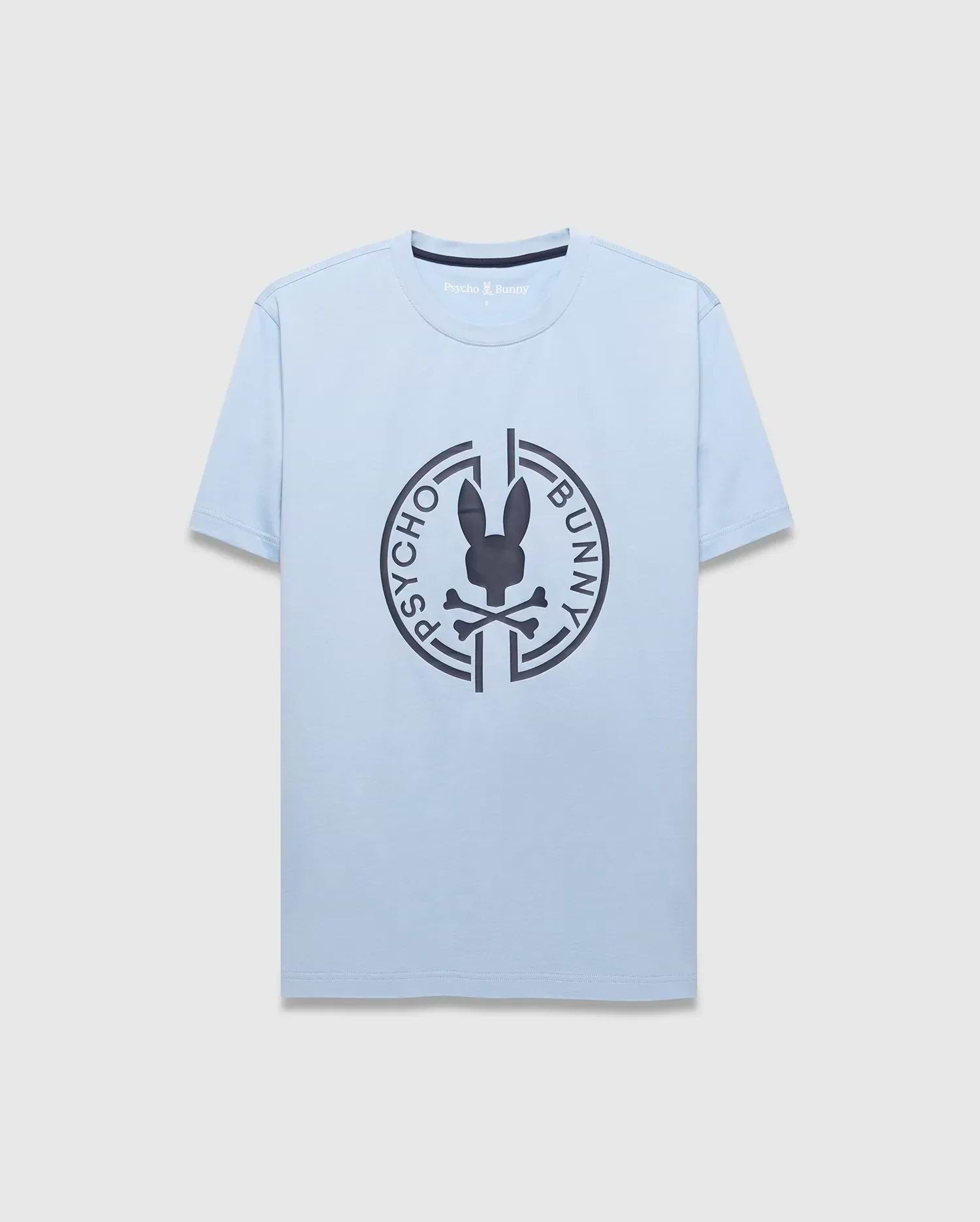 Mens Santa Fe Bunny Graphic Tee. Light blue jersey t-shirt with a classic fit, featuring a large dark grey circular chest graphic of the iconic Psycho Bunny skull logo and brand name. (1)