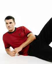 Men's Edmonds Chest Bunny Sport Tee, a classic fit deep red jersey knit t-shirt with black ribbed collar and cuffs, featuring a small black embroidered bunny skull on the left chest and Psycho Bunny text on the right sleeve. (3)