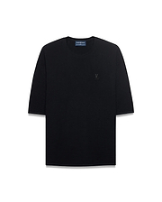 Mens Makai Textured Knit T-Shirt in black, featuring a relaxed fit, textured knit fabric, and a tonal embroidered Psycho Bunny skull logo on the left chest.