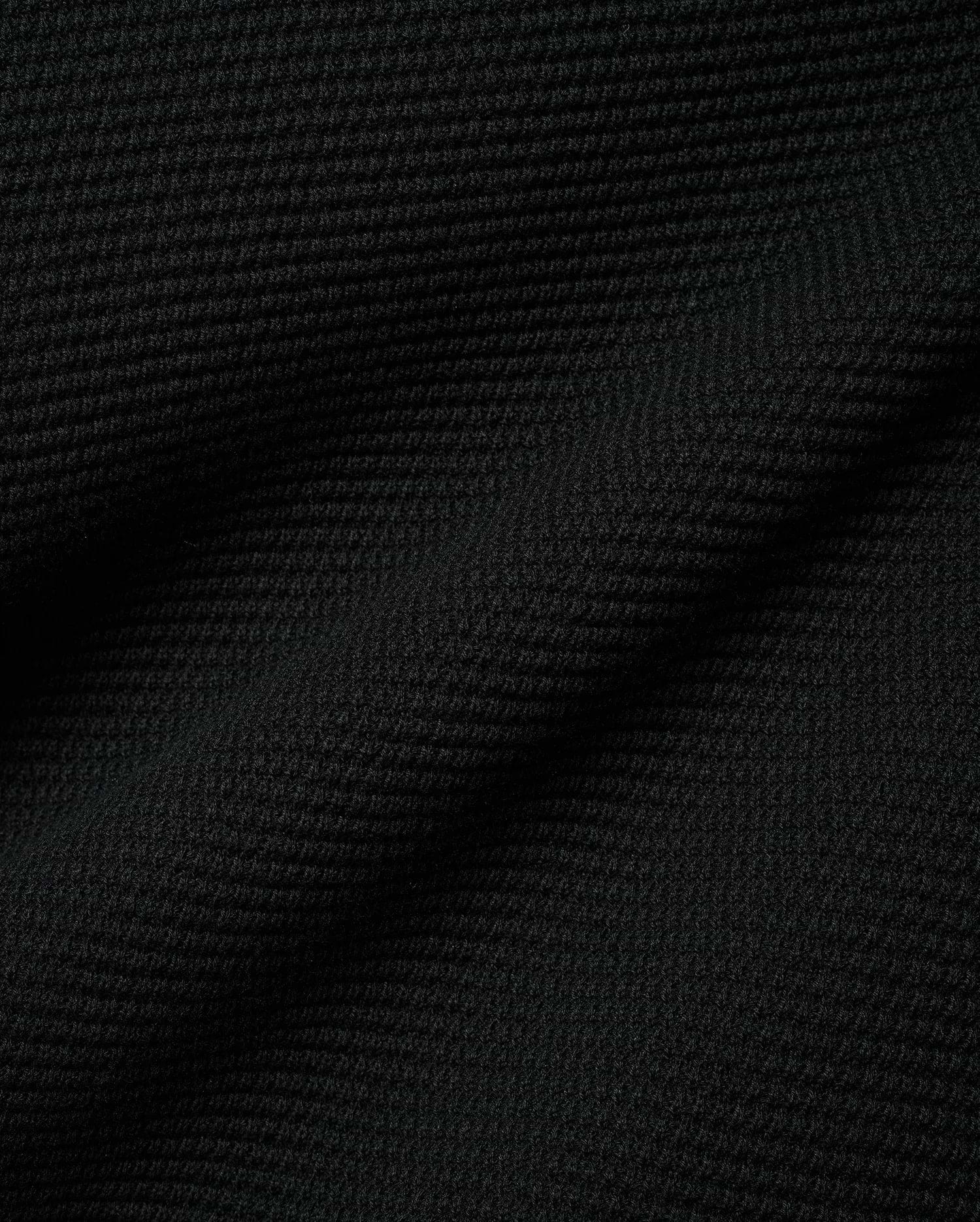 Black Makai Textured Knit T-Shirt, a premium streetwear garment featuring a distinct, small-scale horizontal textured knit pattern, reflecting Psycho Bunny's refined aesthetic.