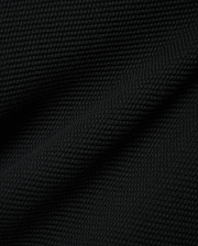Black Makai Textured Knit T-Shirt, a premium streetwear garment featuring a distinct, small-scale horizontal textured knit pattern, reflecting Psycho Bunny's refined aesthetic.