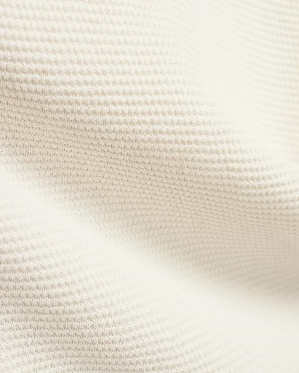 Mens Makai Textured Knit T-Shirt in creamy off-white, showcasing a refined, subtly raised pique-like knit fabric texture, ideal for premium Psycho Bunny streetwear style.