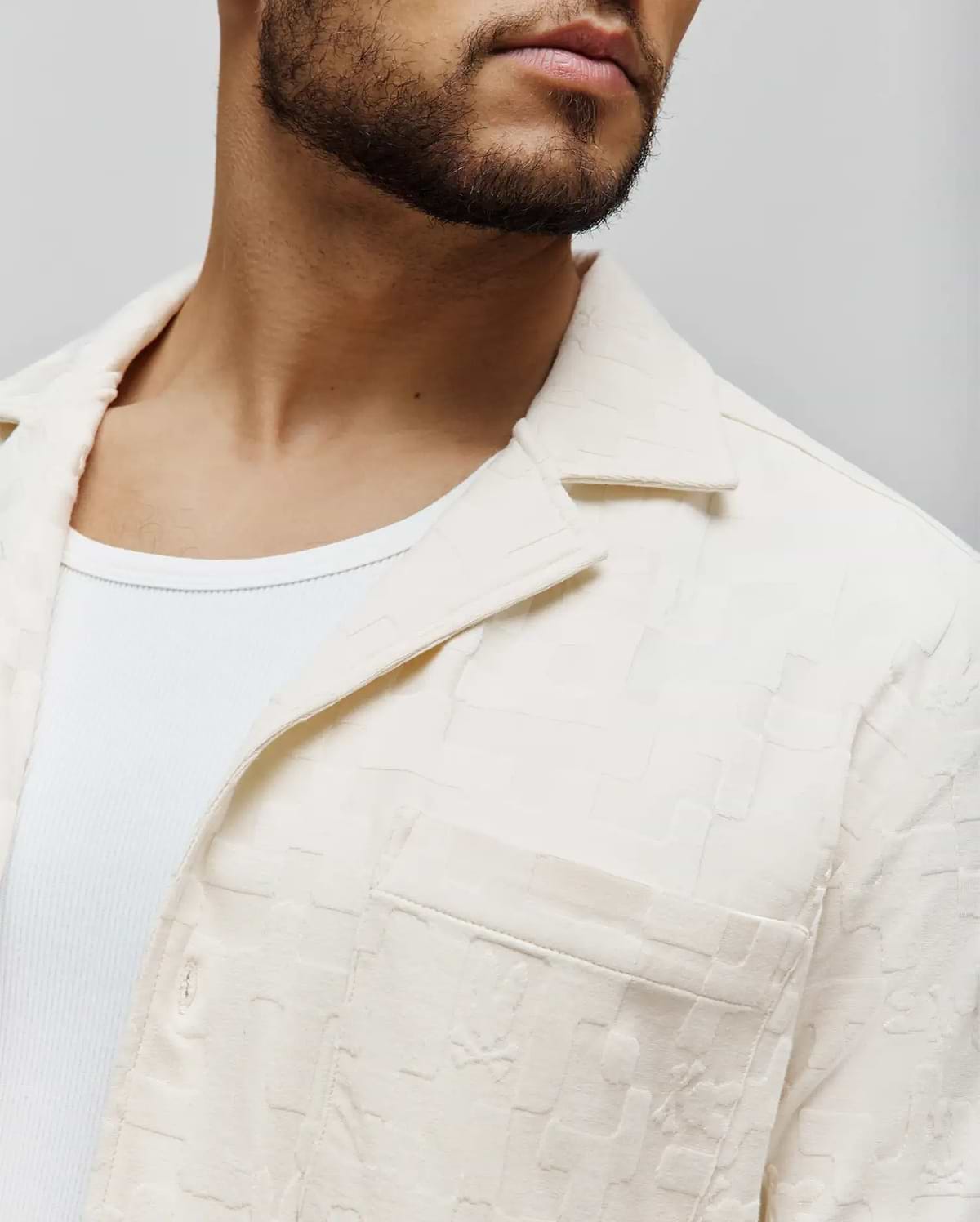 Mens Josh Jacquard Shirt, a cream collared button-up shirt with a soft, textured geometric jacquard pattern, featuring a classic fit and a single chest pocket.