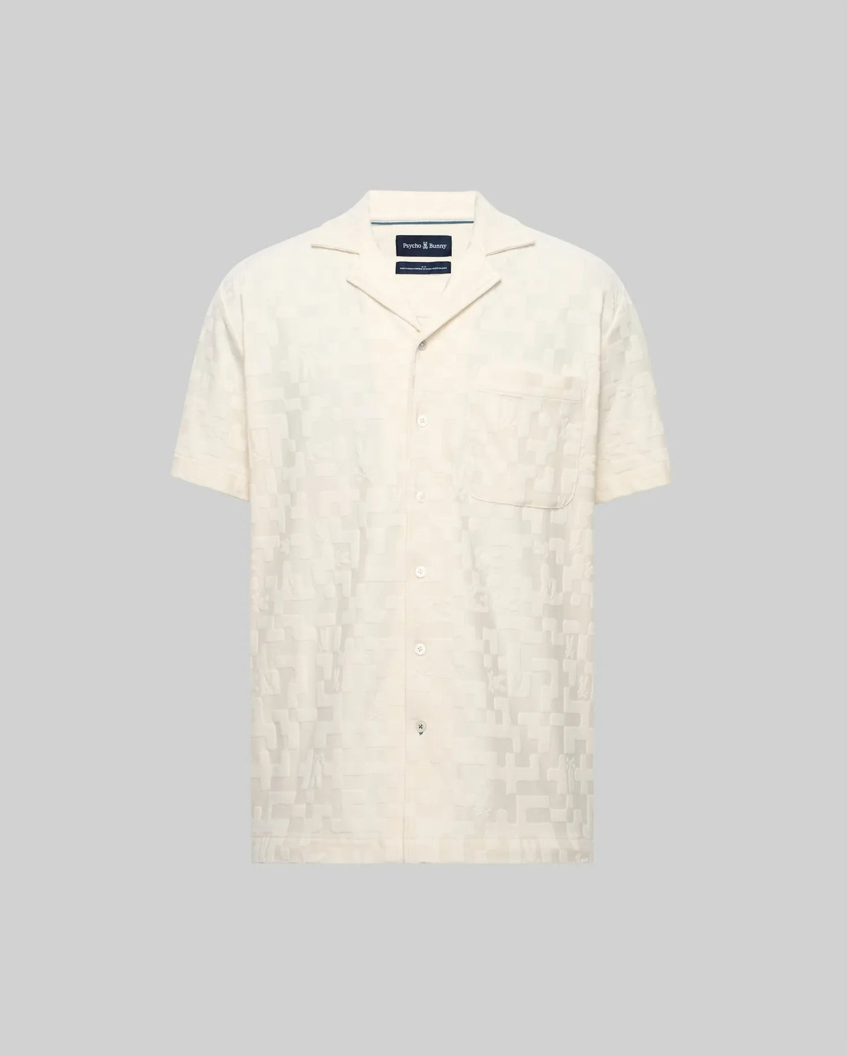 Mens Josh Jacquard Shirt, a cream short-sleeve button-up with a subtle all-over geometric jacquard pattern, relaxed fit, spread collar, and a single chest patch pocket.
