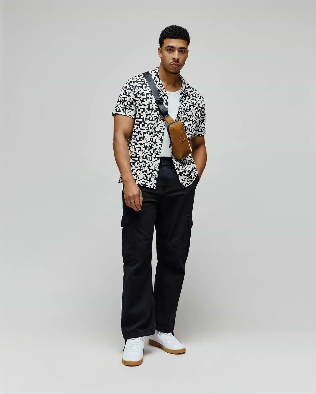 Mens Josh Jacquard Shirt, a white shirt with a black pixelated jacquard pattern featuring integrated Psycho Bunny skull logos, in a relaxed fit.