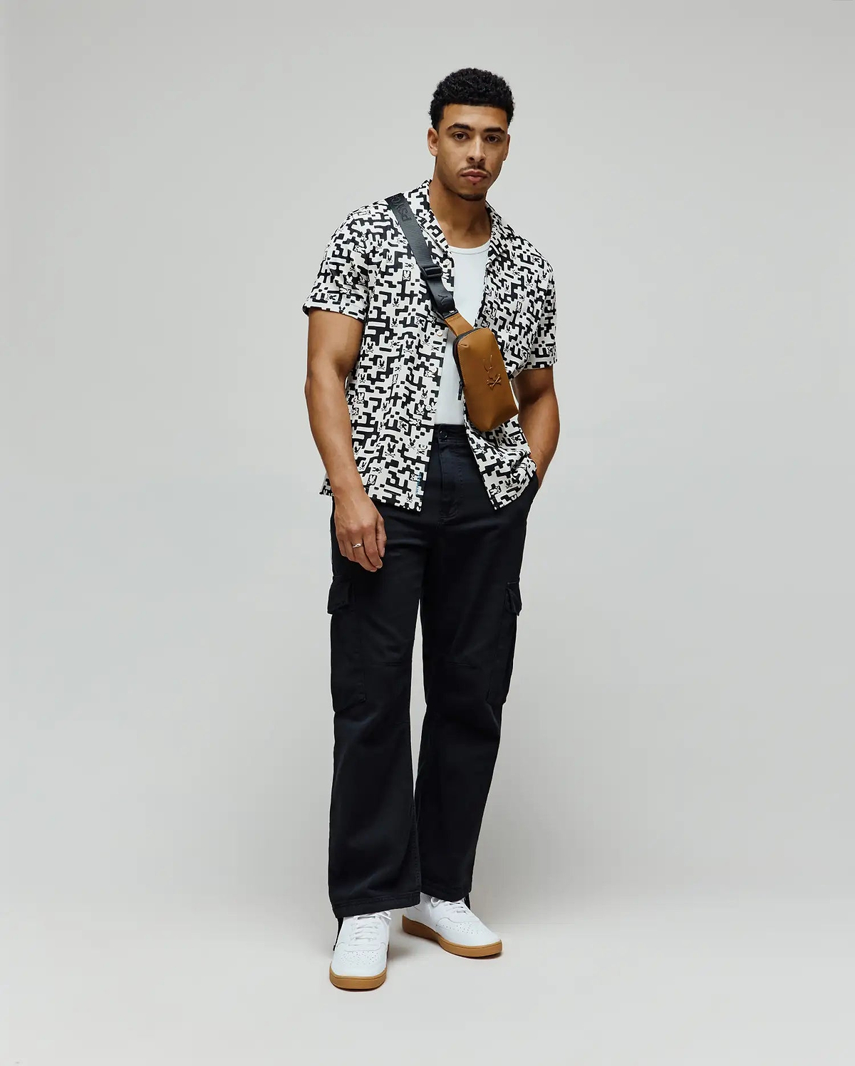 Mens Josh Jacquard Shirt, a white shirt with a black pixelated jacquard pattern featuring integrated Psycho Bunny skull logos, in a relaxed fit.