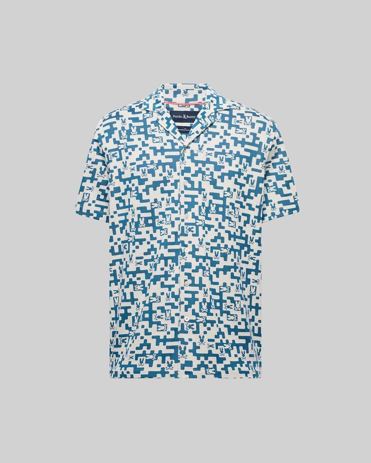 Mens Josh Jacquard Shirt in cream with an all-over blue pixelated Psycho Bunny skull and geometric jacquard pattern, featuring a classic fit and short sleeves.