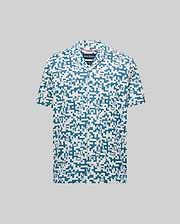 Mens Josh Jacquard Shirt in cream with an all-over blue pixelated Psycho Bunny skull and geometric jacquard pattern, featuring a classic fit and short sleeves.