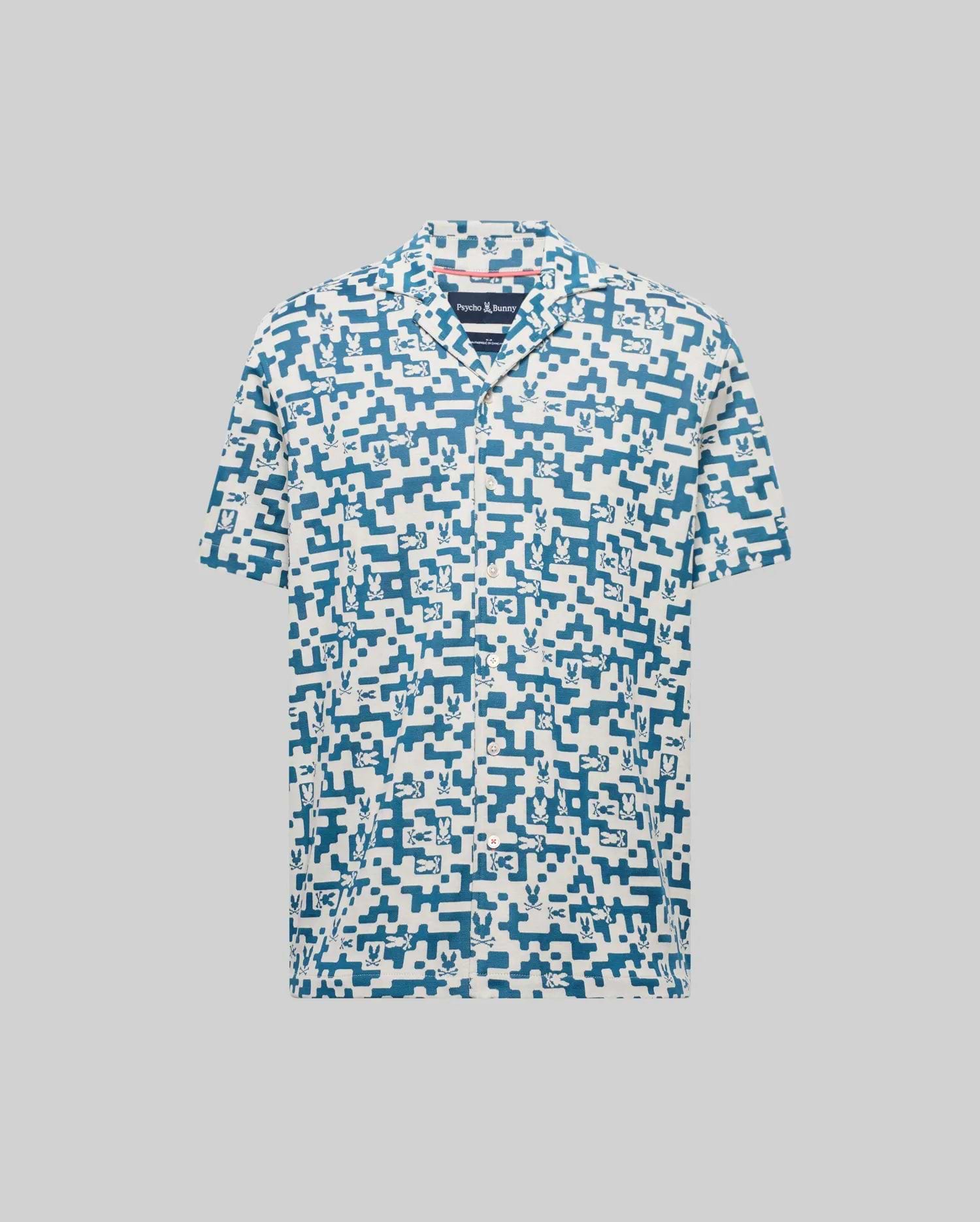 Mens Josh Jacquard Shirt in cream with an all-over blue pixelated Psycho Bunny skull and geometric jacquard pattern, featuring a classic fit and short sleeves.