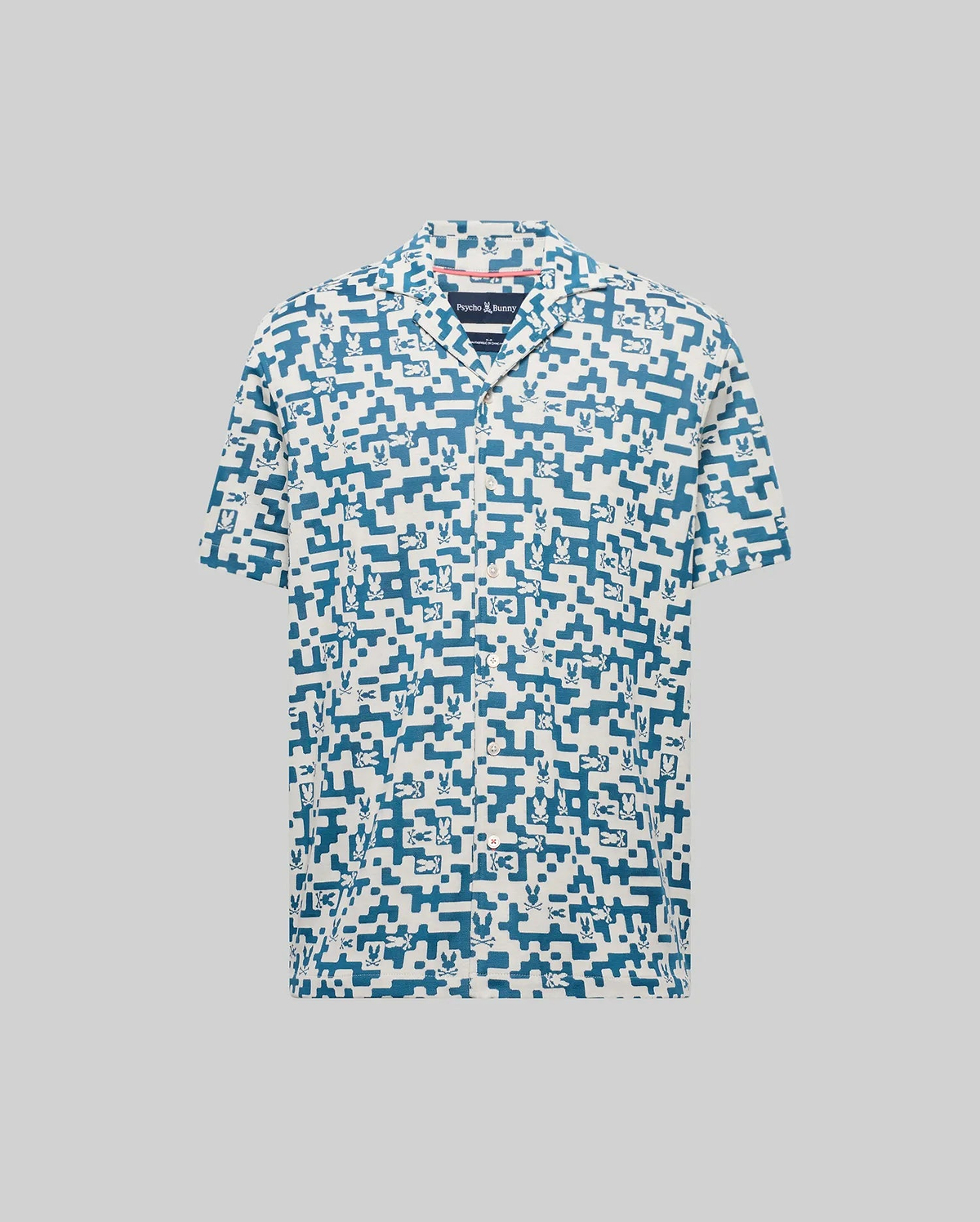 Mens Josh Jacquard Shirt in cream with an all-over blue pixelated Psycho Bunny skull and geometric jacquard pattern, featuring a classic fit and short sleeves.