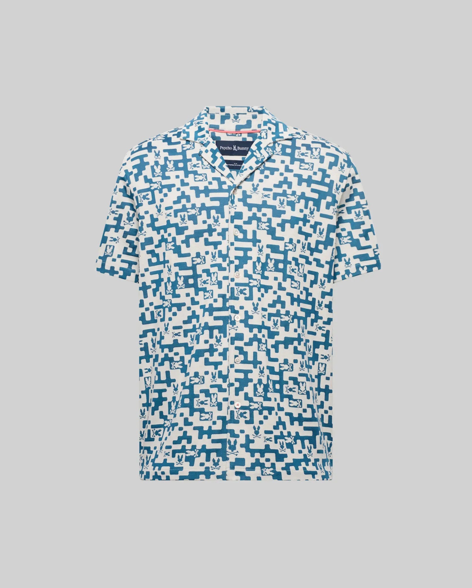 Mens Josh Jacquard Shirt in cream with an all-over blue pixelated Psycho Bunny skull and geometric jacquard pattern, featuring a classic fit and short sleeves.