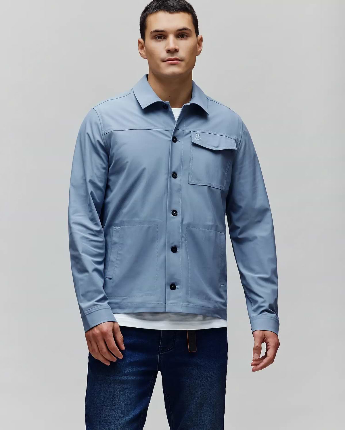 Mens Maverick Overshirt, slate blue, classic fit. Full button-front, black buttons, two chest flap pockets with small embroidered Psycho Bunny skull logo, two large patch pockets. (1)