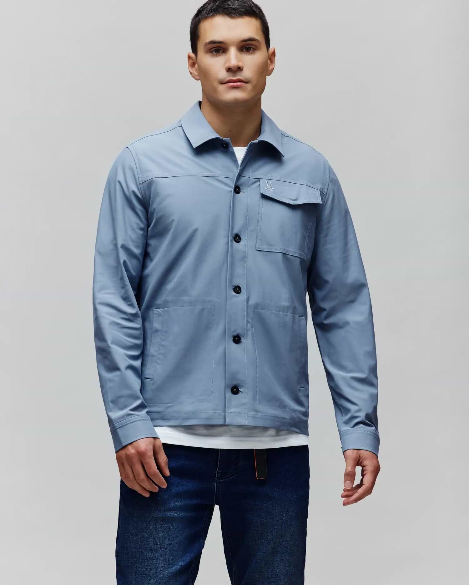 Mens Maverick Overshirt, slate blue, classic fit. Full button-front, black buttons, two chest flap pockets with small embroidered Psycho Bunny skull logo, two large patch pockets. (1)