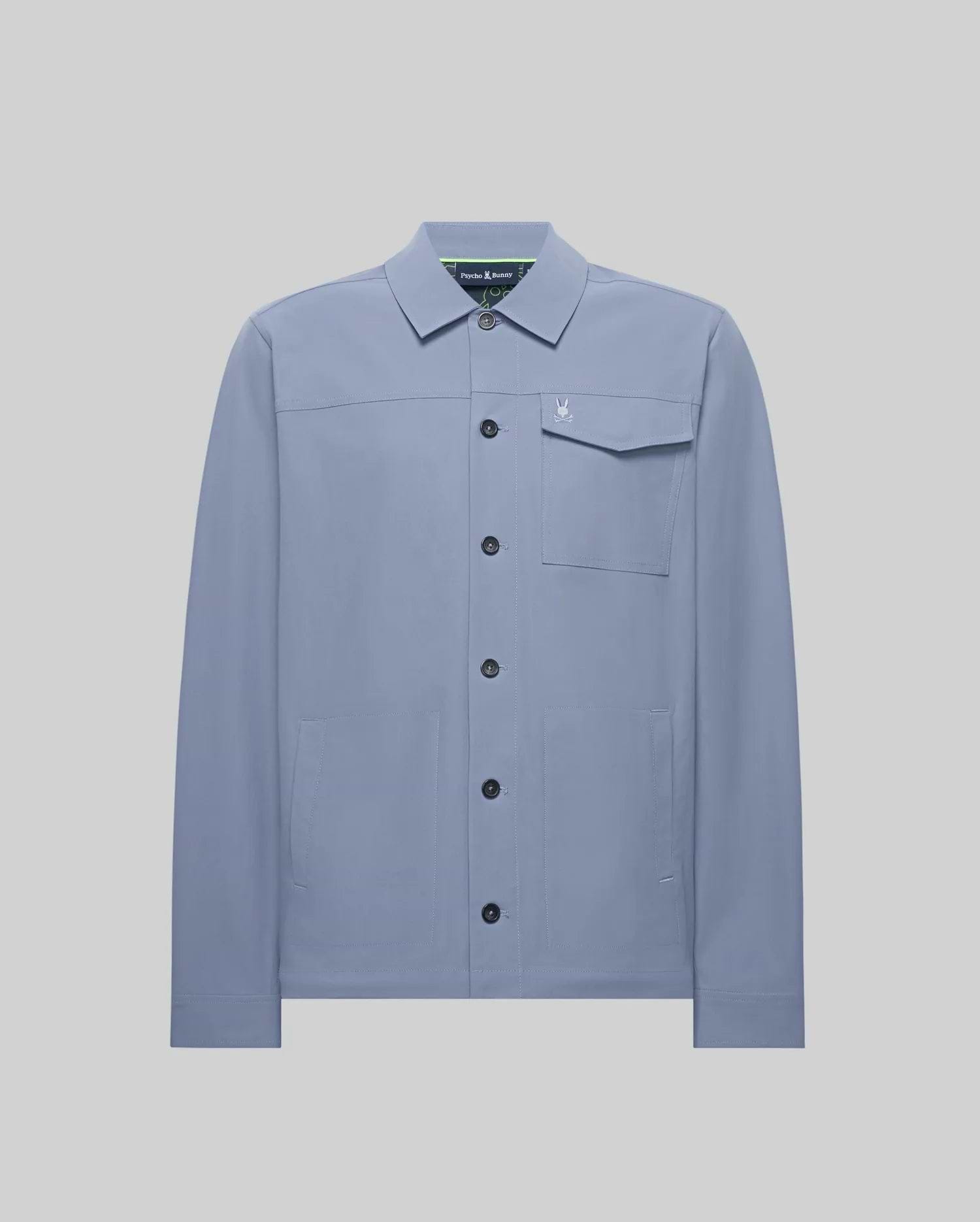 Mens Maverick Overshirt, a dusty blue collared overshirt in smooth fabric, featuring a full button-front, left chest flap pocket with a small embroidered Psycho Bunny skull logo, and two lower welt pockets. (5)