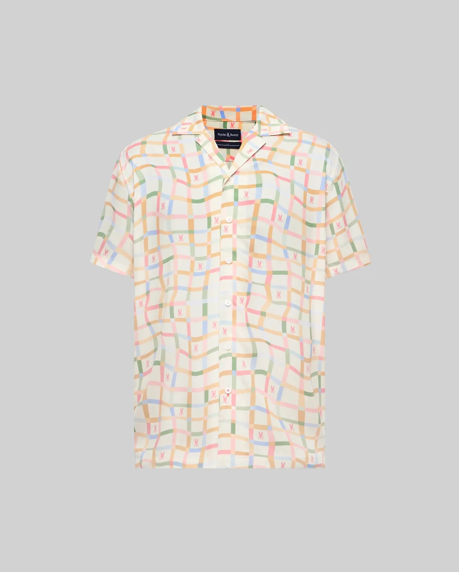 Mens Atlas Tencel Shirt, a relaxed fit cream short-sleeve button-up with a pastel wavy grid pattern in pink, green, blue, and orange, featuring small repeating Psycho Bunny skull logos.