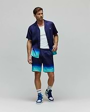 Mens Dax Tencel Shirt and matching shorts, both featuring a navy to teal ombre design, relaxed fit, smooth fabric, and small embroidered Psycho Bunny skull logos on the chest and leg.