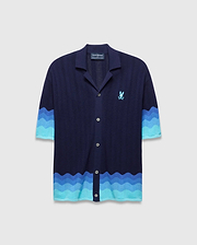 Mens Holden Oversized Knit Shirt, navy blue wavy knit with camp collar, button front, wavy blue gradient stripes sleeves and hem, embroidered light blue Psycho Bunny skull logo left chest.