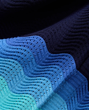 Mens Holden Oversized Knit Shirt in a wavy gradient of dark navy, medium blue, light blue, and teal, featuring an open-knit chevron pattern for a textured, breathable design.